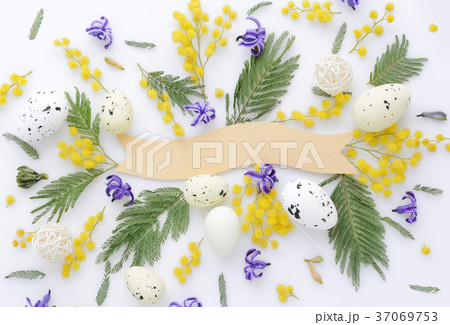 Easter eggs and mimosa and hyacinth flowers 37069753