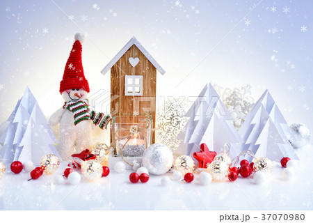 Snowman with Christmas ornaments and toy house 37070980