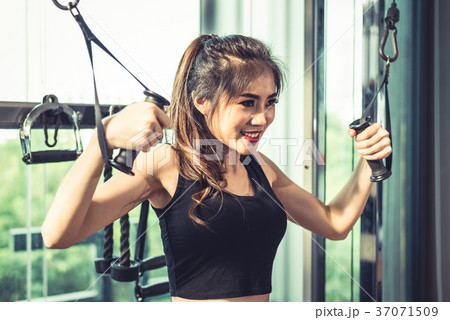 Asian young woman doing elastic rope exercises 37071509