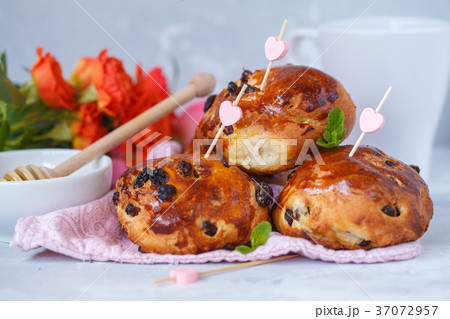 Breakfast for Valentine's Day. Buns with raisins Breakfast for Valentine's Day. Buns with raisins 37072957