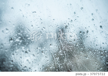 closeup of rain drops on window 37073722