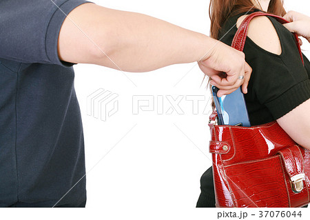 man pickpocketing a purse from woman's bag 37076044