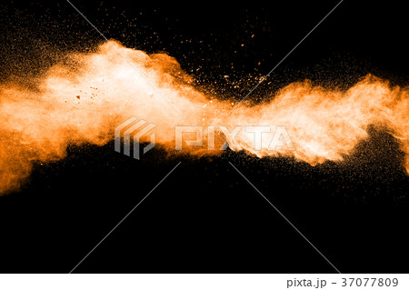 abstract orange powder explosion on black. abstract orange powder explosion on black. 37077809