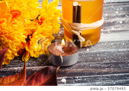 Yellow chrysanthemum, lit golden candles leaves Yellow chrysanthemum, lit golden candles leaves 37079483