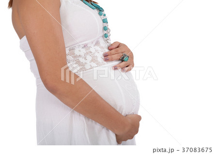pregnant young woman isolated on a white 37083675