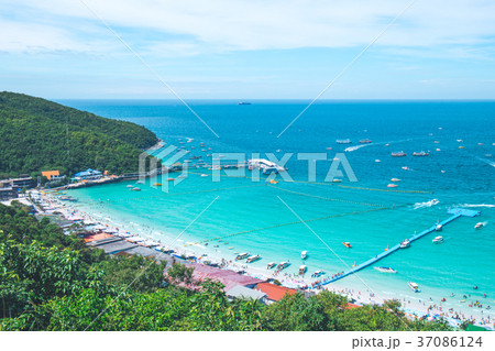 beautiful beach with tourists and harbor. beautiful beach with tourists and harbor. 37086124
