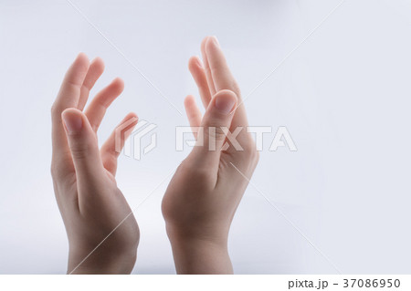 Hand holding gesture on a white background 37086950