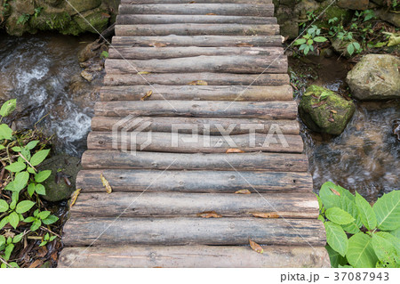 Top view wooden bridge over small river 37087943
