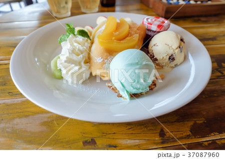 crepe with fresh fruit  on wooden table 37087960