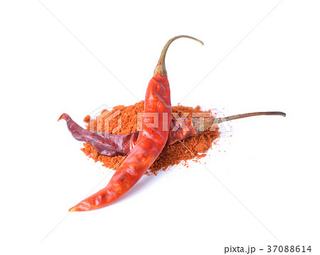 Dried red peppers and flakes  on white. 37088614