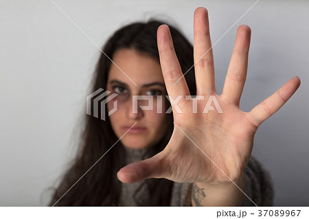 Abused woman stretching out her spread hand 37089967