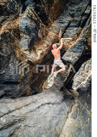 Man climbing up the rock 37093781