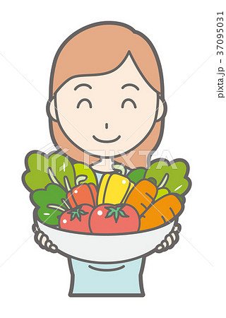 グリーンの服を着た妊婦が野菜を持っている 37095031
