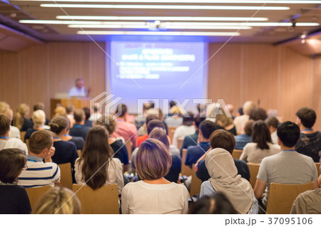 Audience in lecture hall on scientific conference. Audience in lecture hall on scientific conference. 37095106