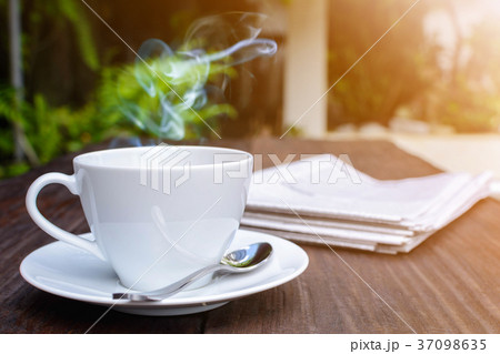 coffee cup clock and news paper coffee cup clock and news paper 37098635