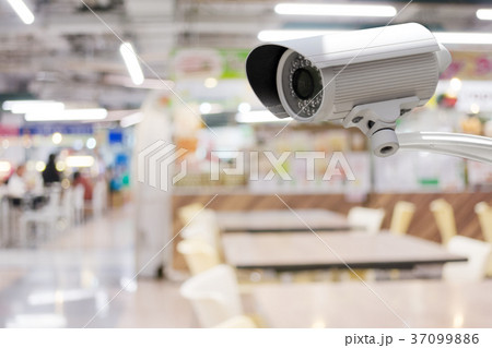 CCTV camera with abstract blurred food court  37099886