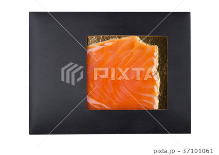 Black paper package with raw fresh salmon slices 37101061
