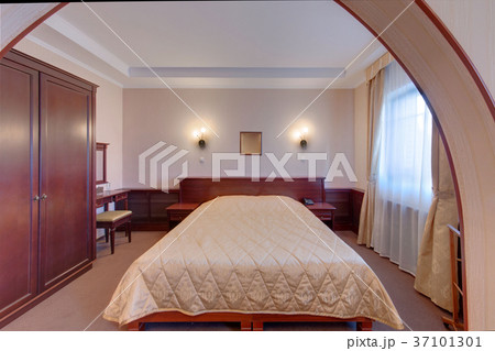 The bedroom with a big bed, with lamps, a cabinet The bedroom with a big bed, with lamps, a cabinet 37101301