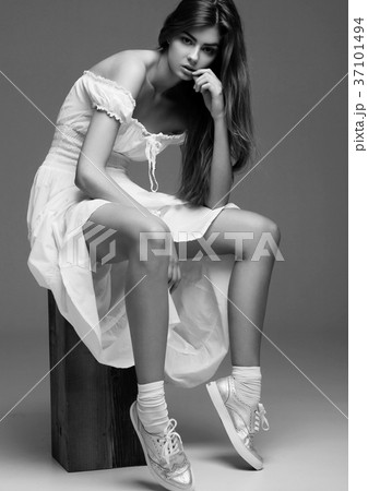 Beautiful young girl fashion girl in white dress Beautiful young girl fashion girl in white dress 37101494