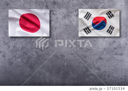 South Korea and Japan flag on concrete background. South Korea and Japan flag on concrete background. 37101534