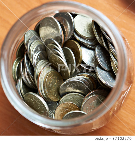 Coins rubles in a glass jar 37102270