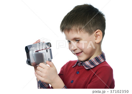 Little boy with video camera isolated Little boy with video camera isolated 37102350