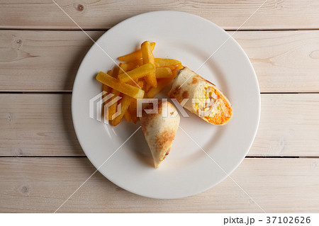 Meat, carrot, cabbage and cheese rolled in pitta 37102626