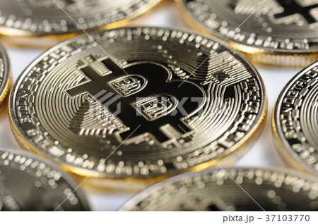 Macro view of shiny Bitcoin souvenire coins Macro view of shiny Bitcoin souvenire coins 37103770