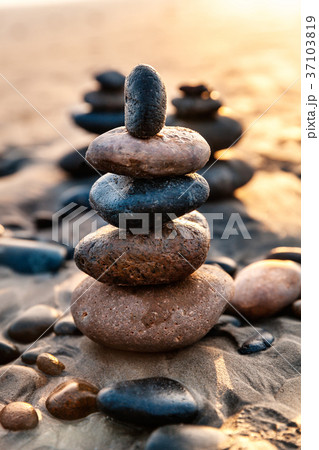 Balanced Rocks at the Beach in the evening, USA Balanced Rocks at the Beach in the evening, USA 37103819