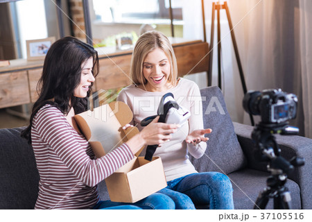 Delighted positive woman holding 3D glasses Delighted positive woman holding 3D glasses 37105516
