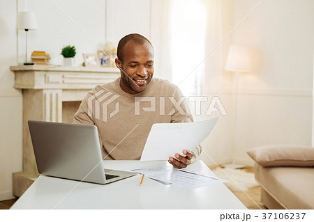 Grinning daddy spending time with his son Grinning daddy spending time with his son 37106237
