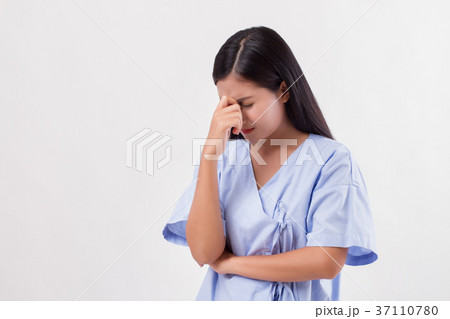 stressed woman patient suffering from headache, pain 37110780