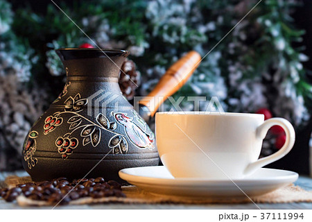 Cozy winter setting with cup of coffee and cezva 37111994