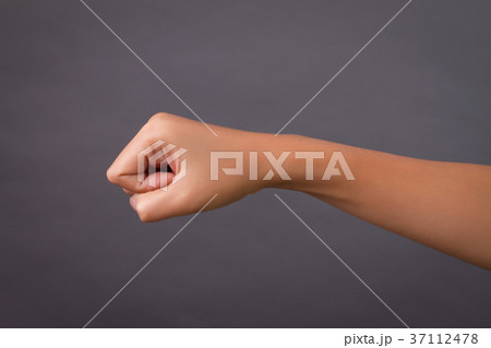 punching woman hand studio isolated 37112478