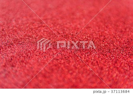 Red glitter defocused texture background. Red glitter defocused texture background. 37113684