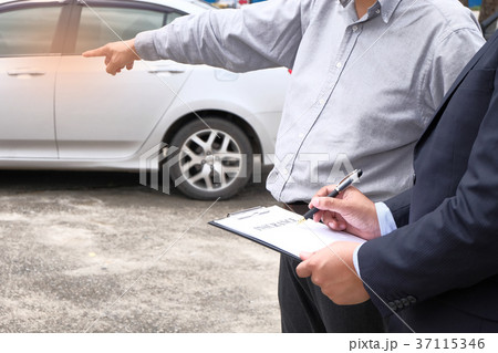 Loss Adjuster Insurance Agent Inspecting Damaged 37115346