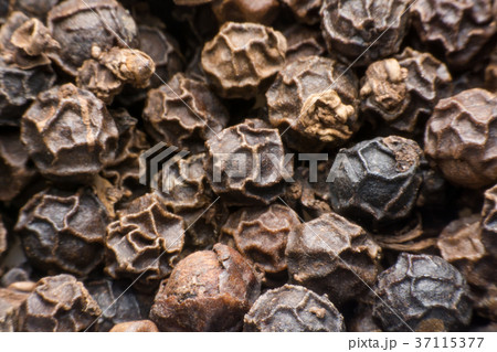 Black pepper grains as background close up Black pepper grains as background close up 37115377