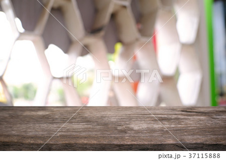 Empty wooden table in front of abstract blurred Empty wooden table in front of abstract blurred 37115888