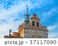 A view to an old decorated bell tower of an ancien 37117090