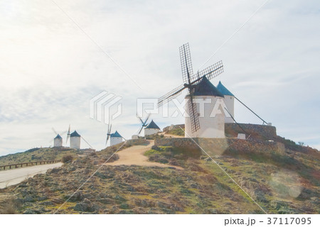 Rows of old white traditional windmills on the  37117095