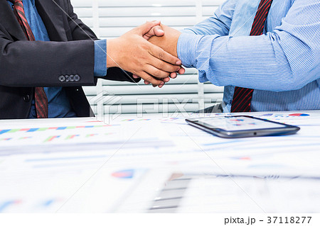 Handshake of office workers and associates 37118277