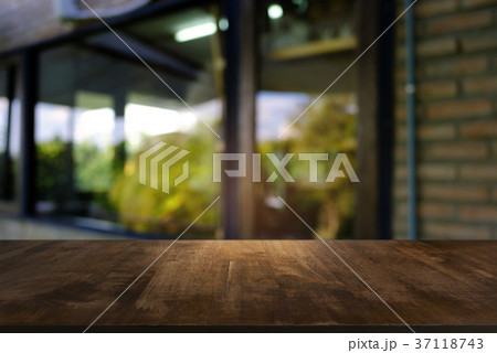Empty wooden table in front of abstract blurred Empty wooden table in front of abstract blurred 37118743