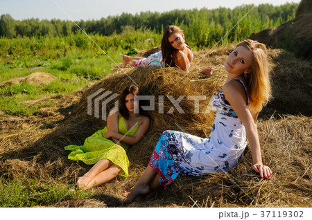 Young beautiful women relax on hay 37119302