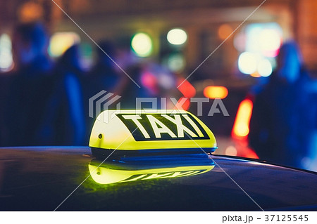 Taxi car on the street at the night Taxi car on the street at the night 37125545