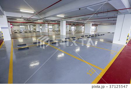 Empty indoor car parking space 37125547