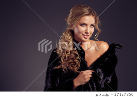 Fashion seductive blond hair lady in an elegant Fashion seductive blond hair lady in an elegant 37127856