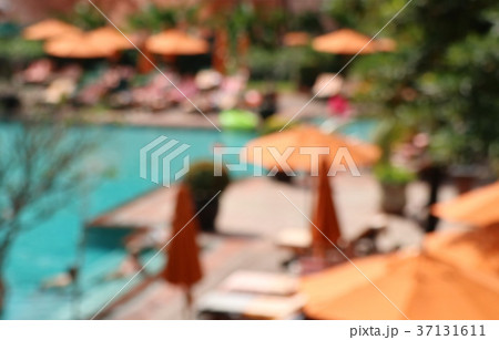 blurred swimming pool with umbrellas blurred swimming pool with umbrellas 37131611