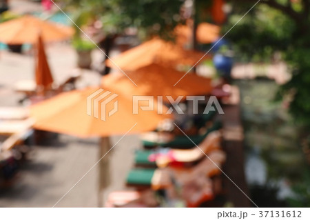 blurred swimming pool with umbrellas blurred swimming pool with umbrellas 37131612