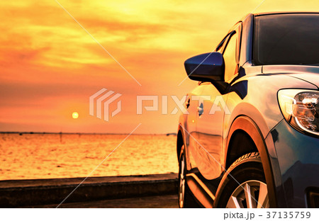 Blue SUV car with sport design parked by the sea  37135759
