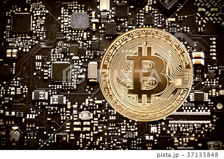 Digital currency bitcoin on computer chip 37135848